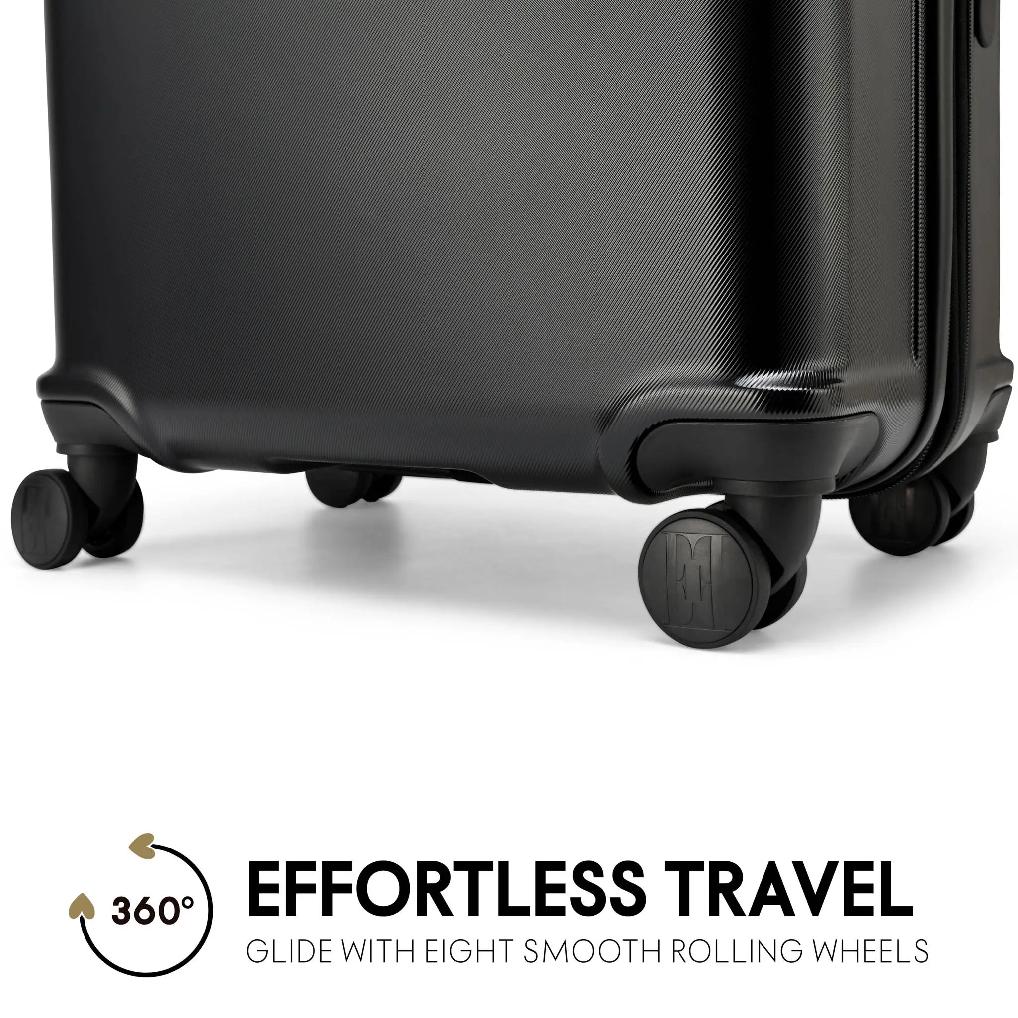 Black suitcase with smooth rolling wheels on a white background, featuring the text 'Effortless Travel'.