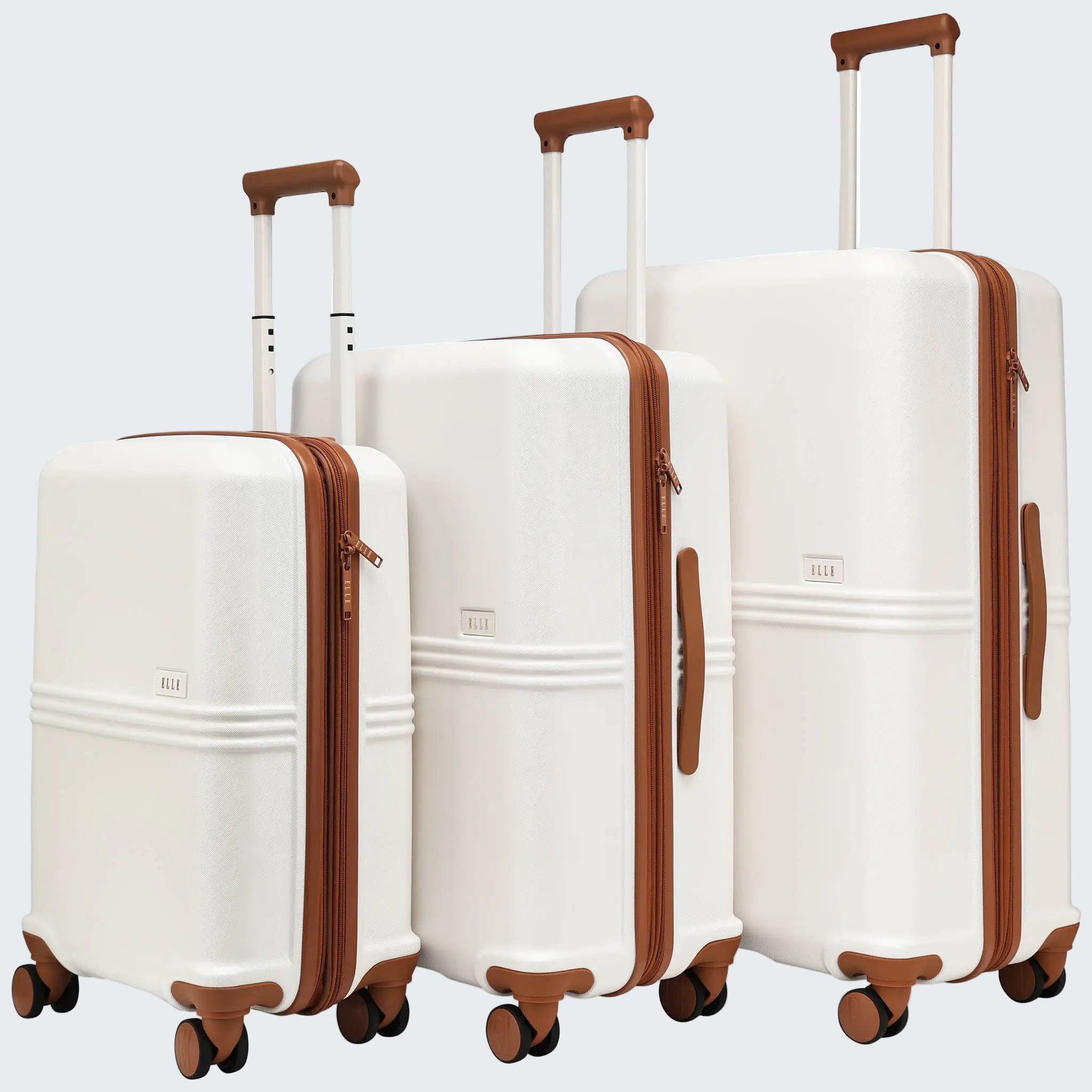 Set of three white suitcases with brown handles and wheels on a white background