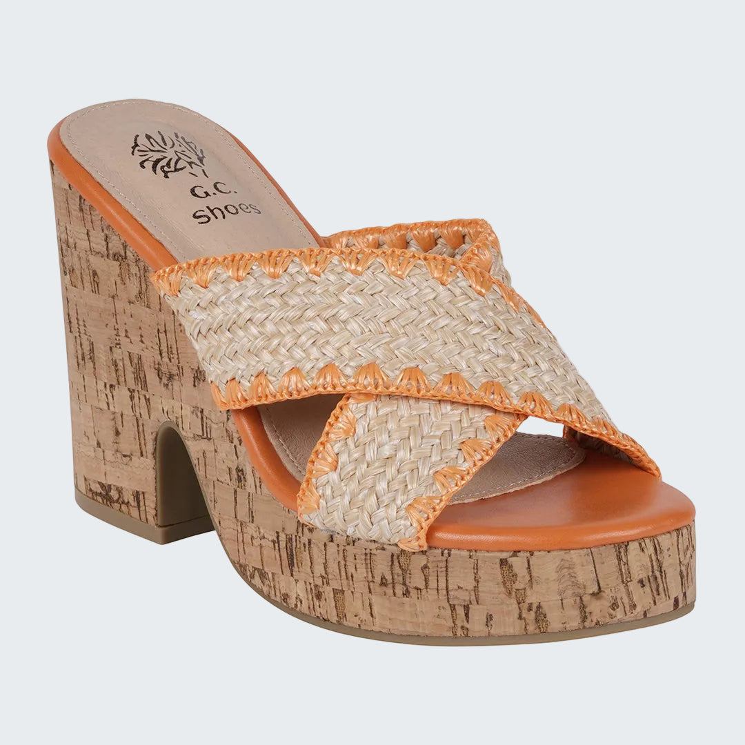 Woven sandal with cork block heel on a white background