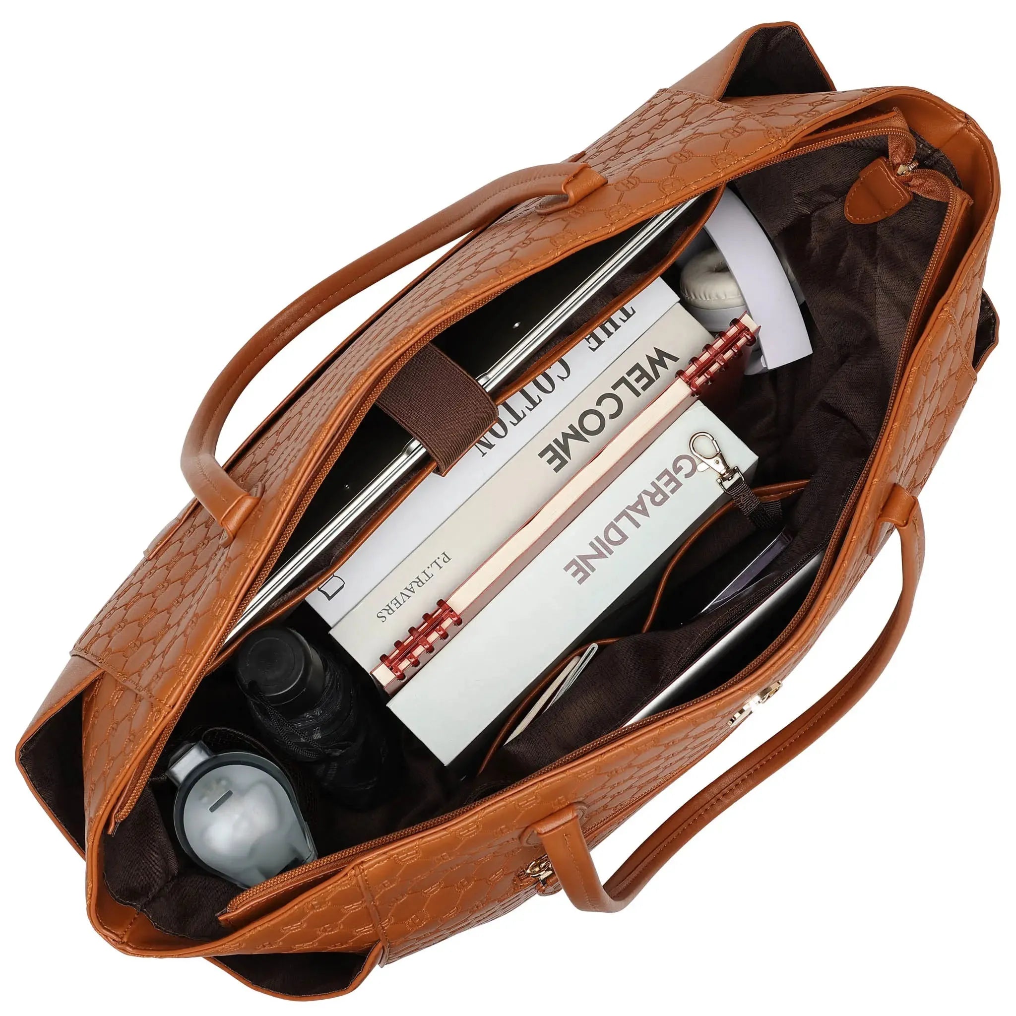 Brown leather handbag with items including a book and a bottle on a white background