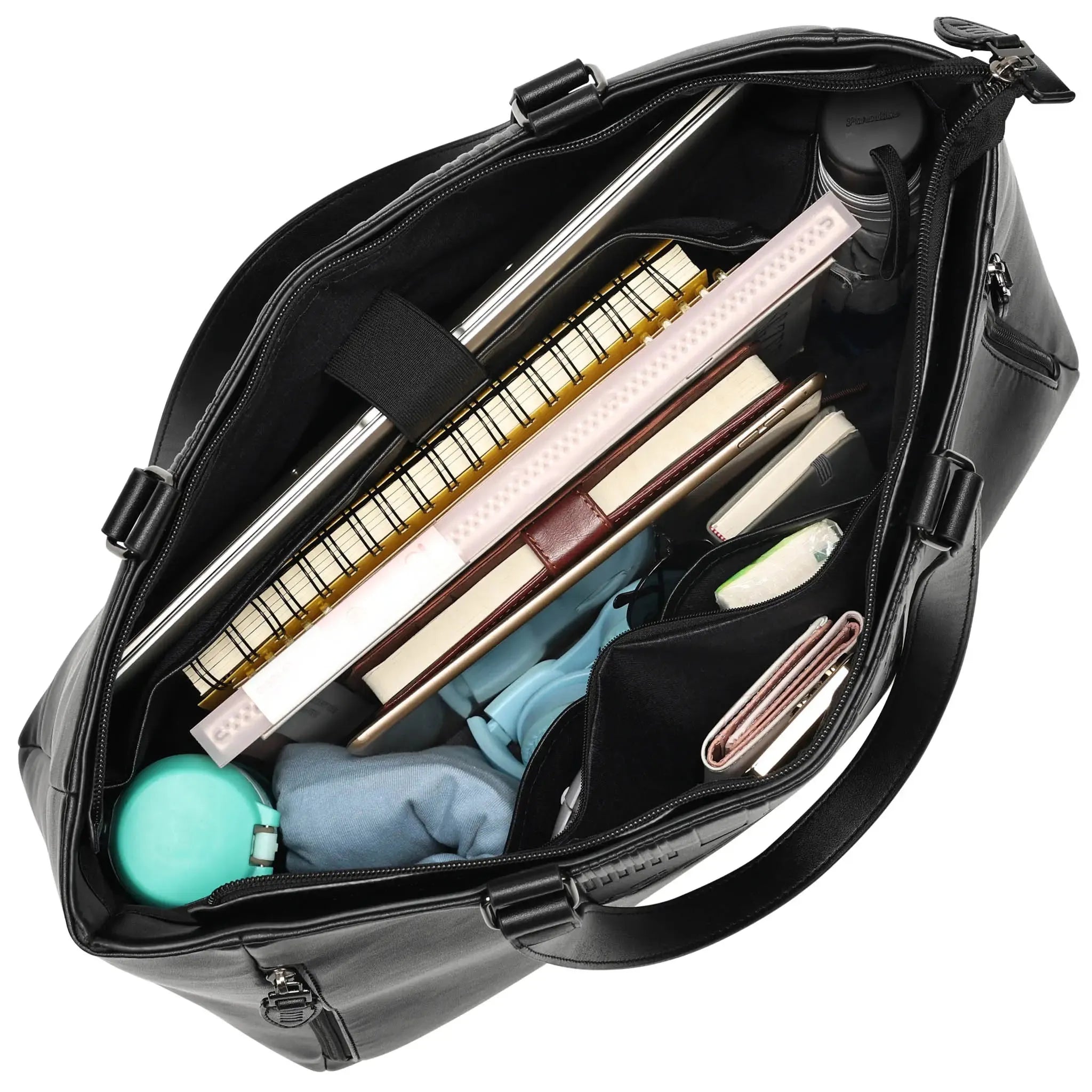 Black bag with various items including a keyboard, books, and a bottle.