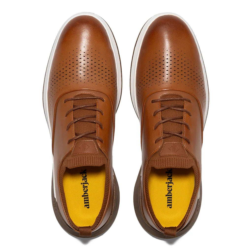 Pair of brown leather shoes with 'amberjack' branding on a white background