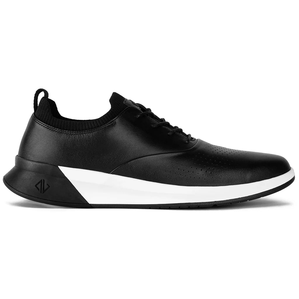 Black athletic shoe with a white sole on a white background