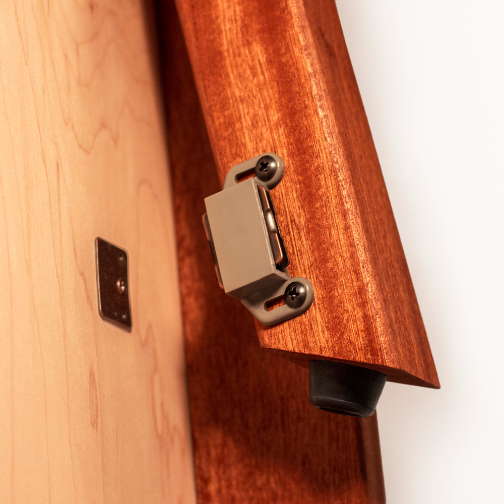 Close-up of a guitar with a wooden neck and metal tuning pegs on a white background