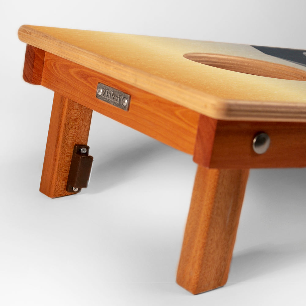 Wooden stool with a visible brand label on a white background