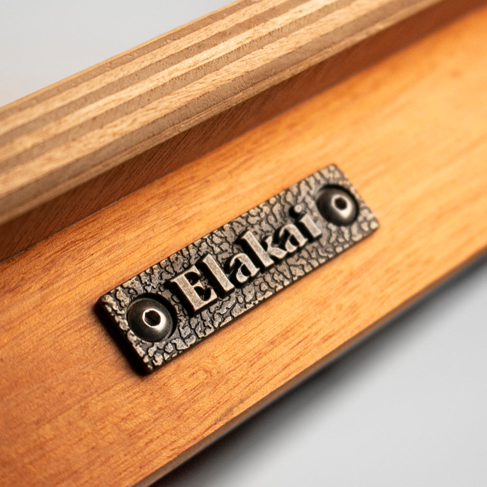 Wooden product with 'Elakat' branding on a gray background