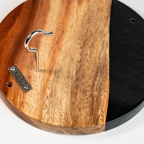 Wooden cutting board with a metal hook on a white background