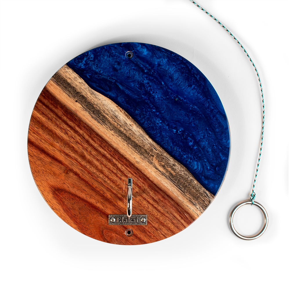 Round wooden and blue resin wall hook with a hanging ring on a white background