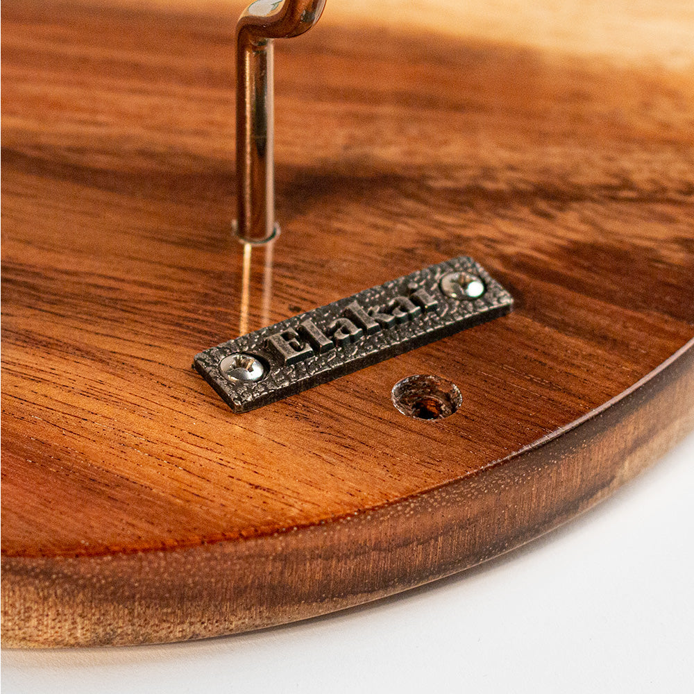 Wooden product with a metal label on a white background