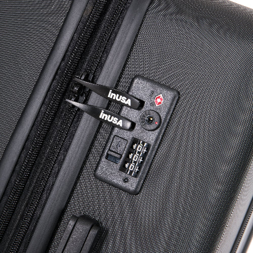 Close-up of a black suitcase with an inUSA lock and digital display.