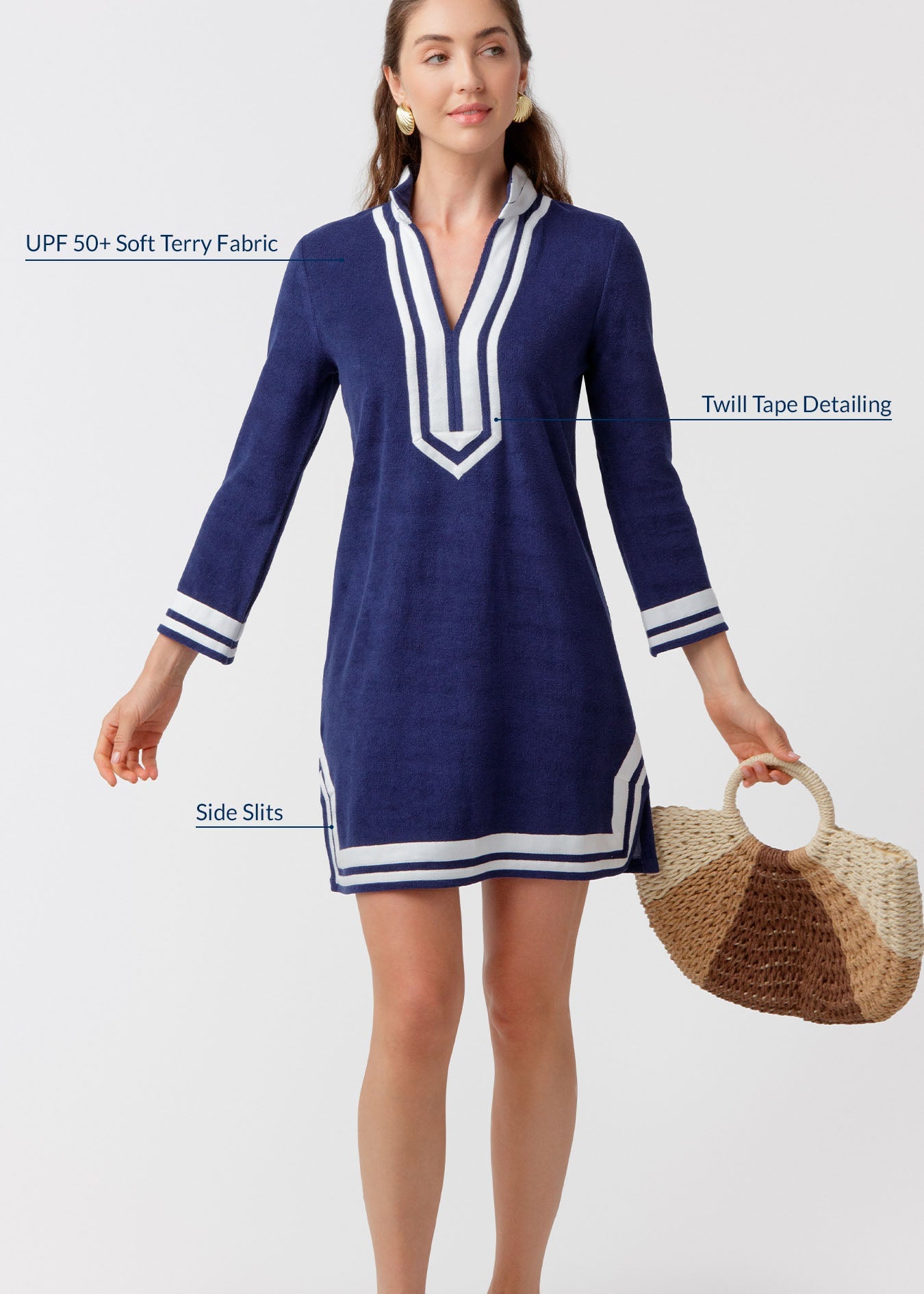 Woman wearing a blue dress with white accents on a white background