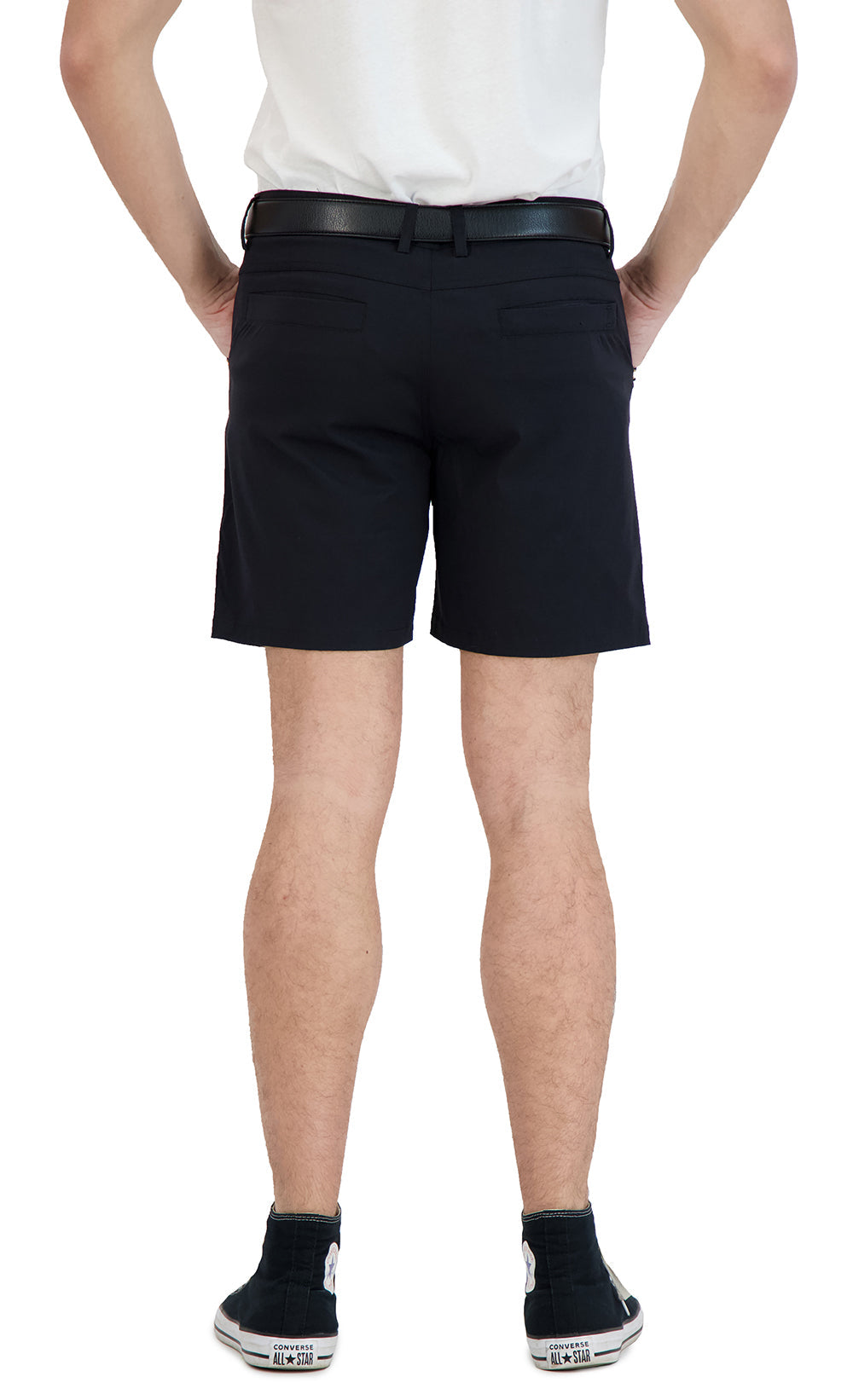 Person wearing black shorts on a white background