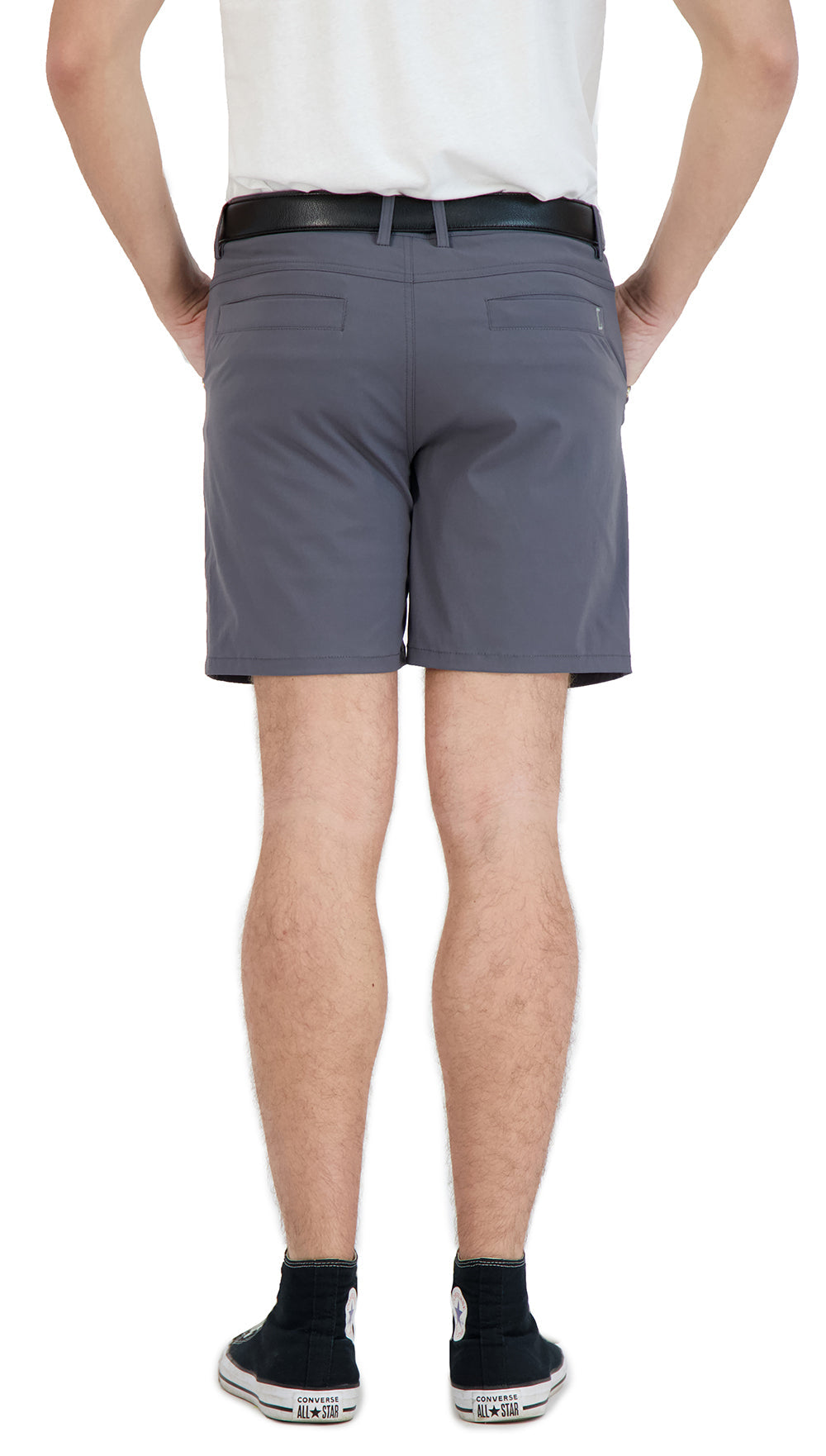 Person wearing gray shorts on a white background