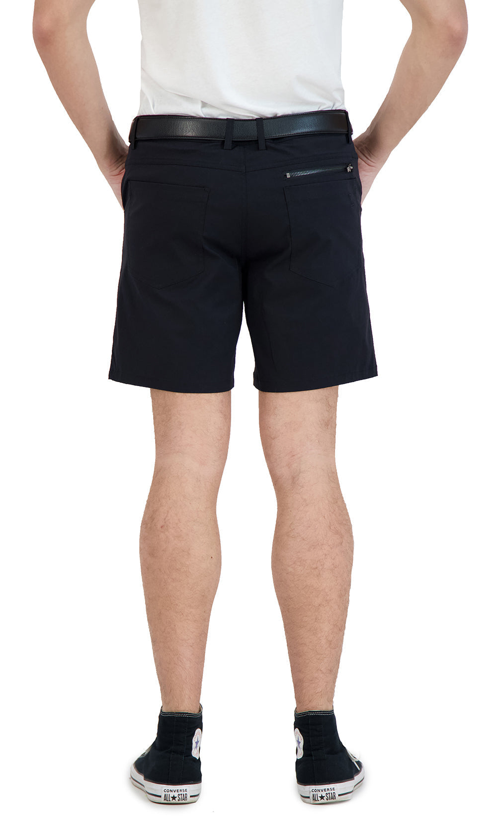 Person wearing black shorts on a white background