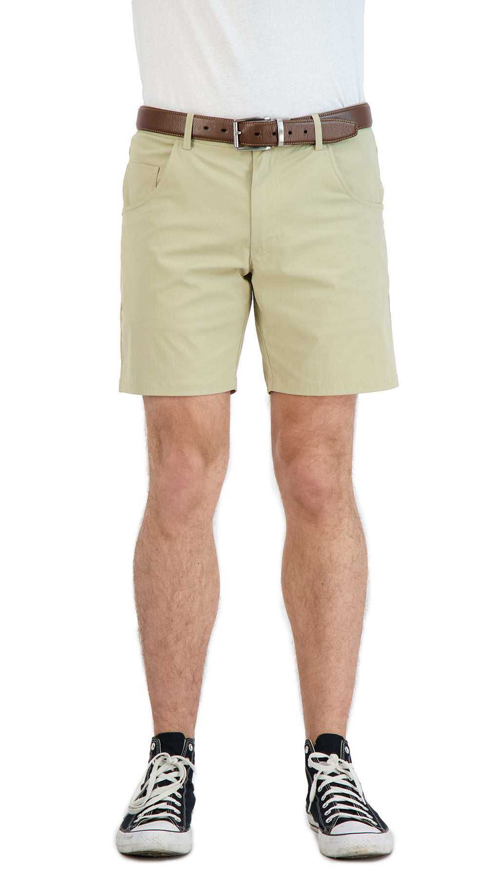 Beige shorts worn by a person on a white background
