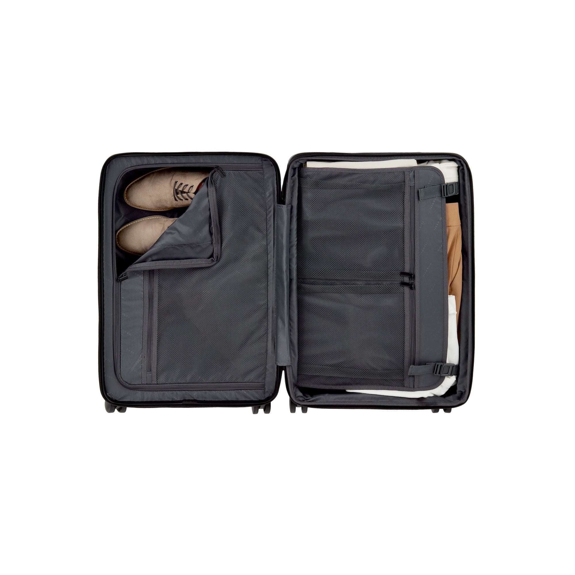 Open suitcase with shoes inside on a white background
