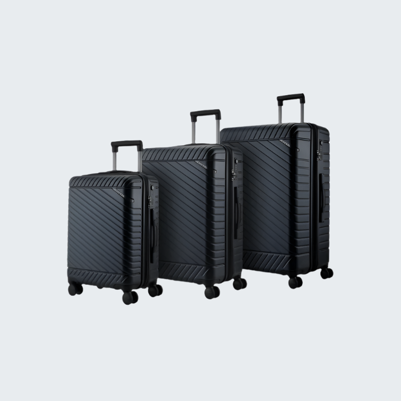 Set of three black suitcases of different sizes on a white background