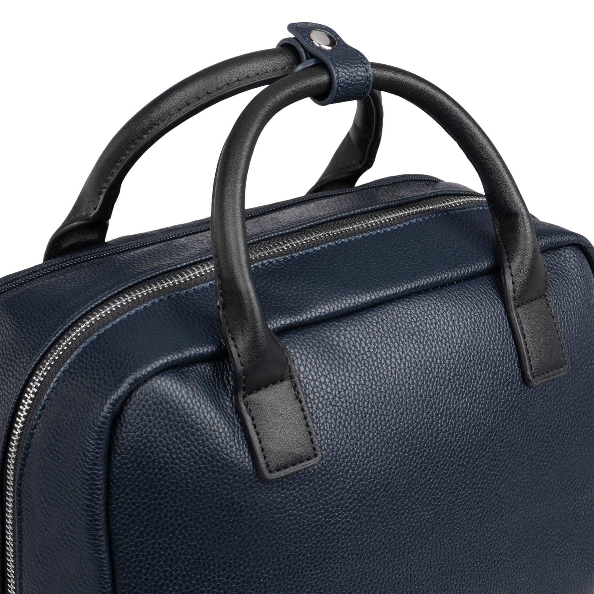 Navy blue leather bag with black handles on a white background