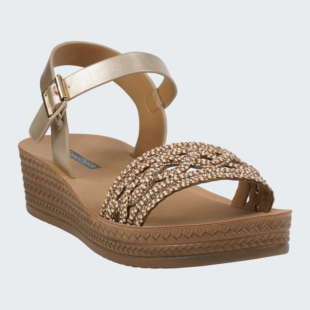 Gold sandal with embellishments on a white background