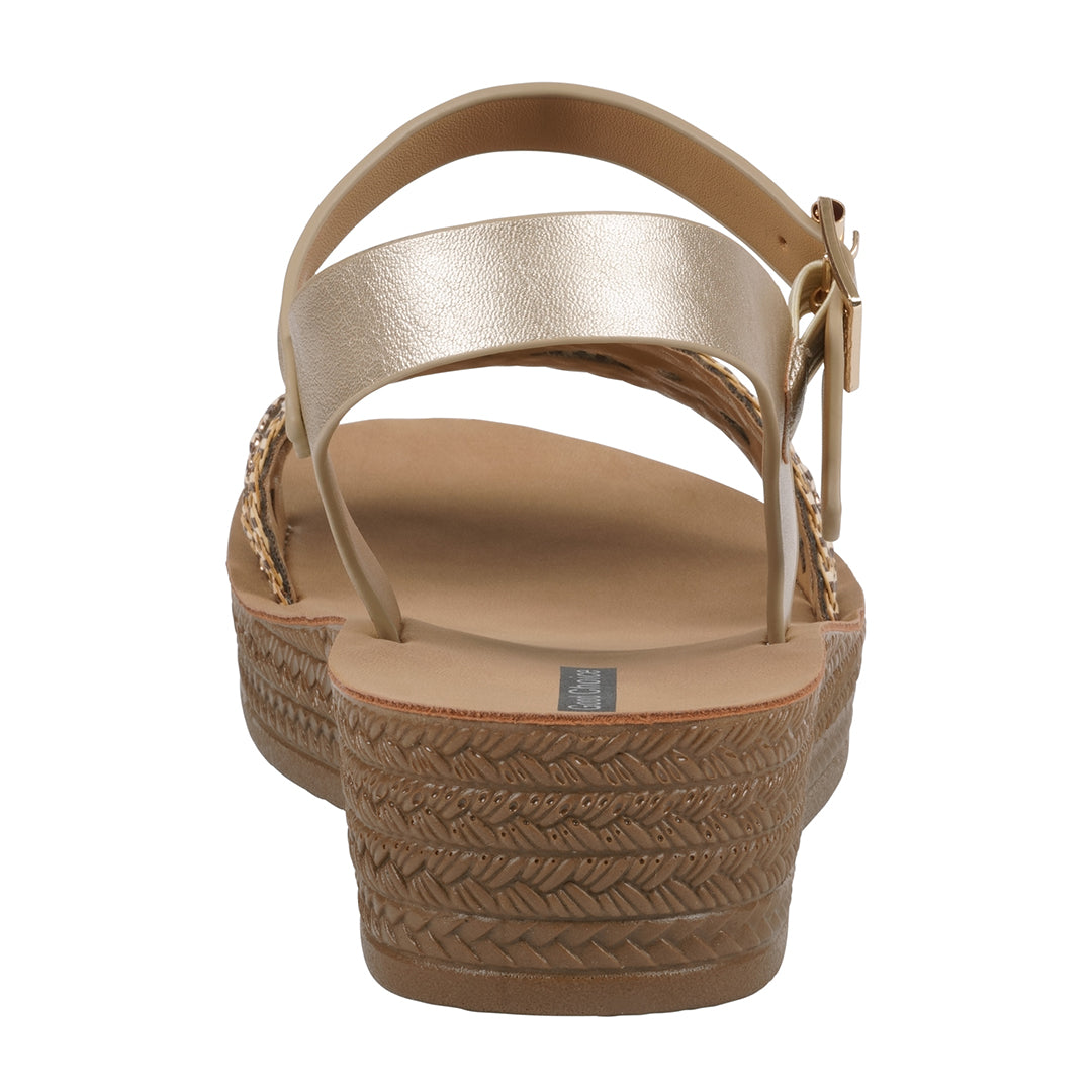 Gold sandal with braided sole on a white background
