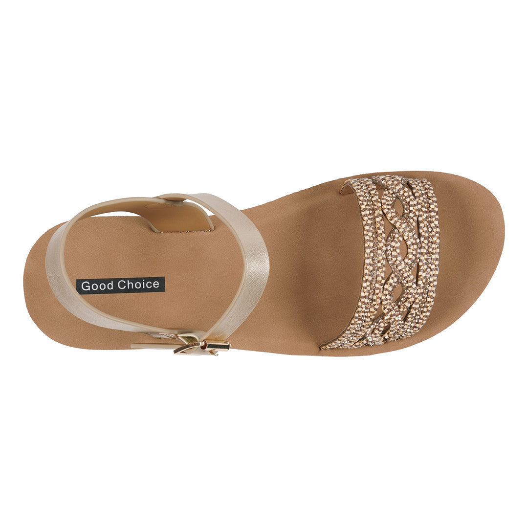 Tan sandal with decorative strap on a white background