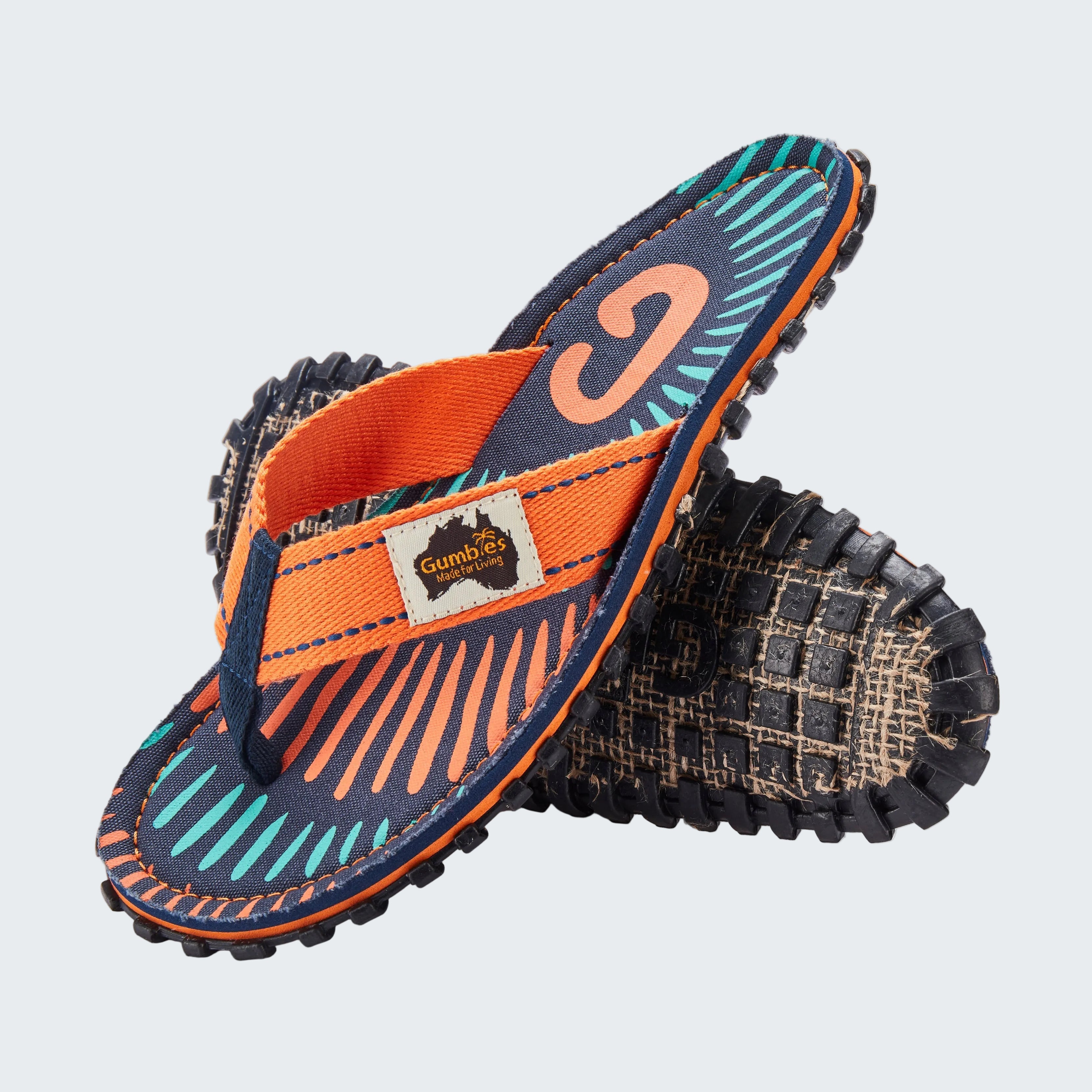 Pair of sandals with orange and blue design on a white background