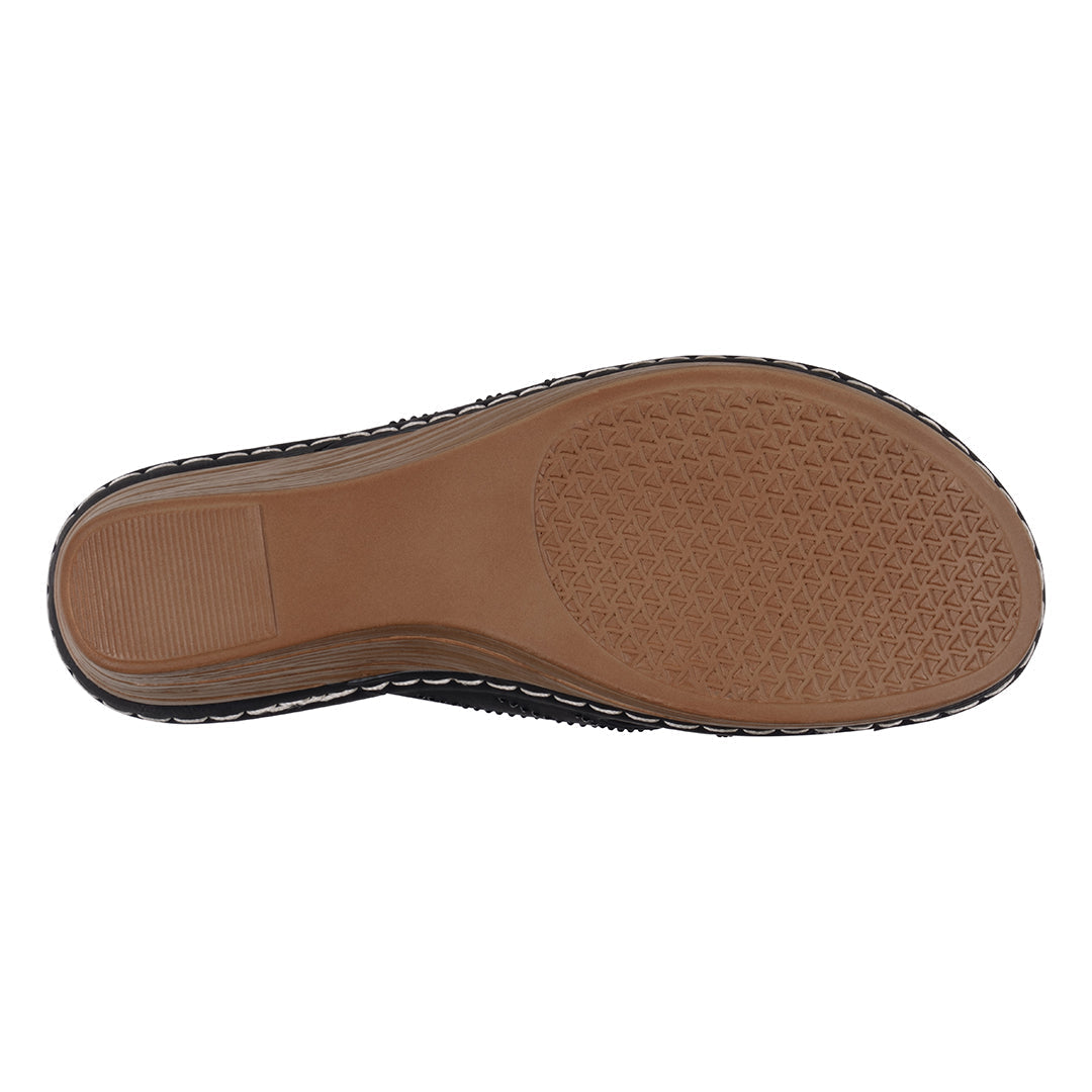 Brown shoe sole with tread pattern on a white background