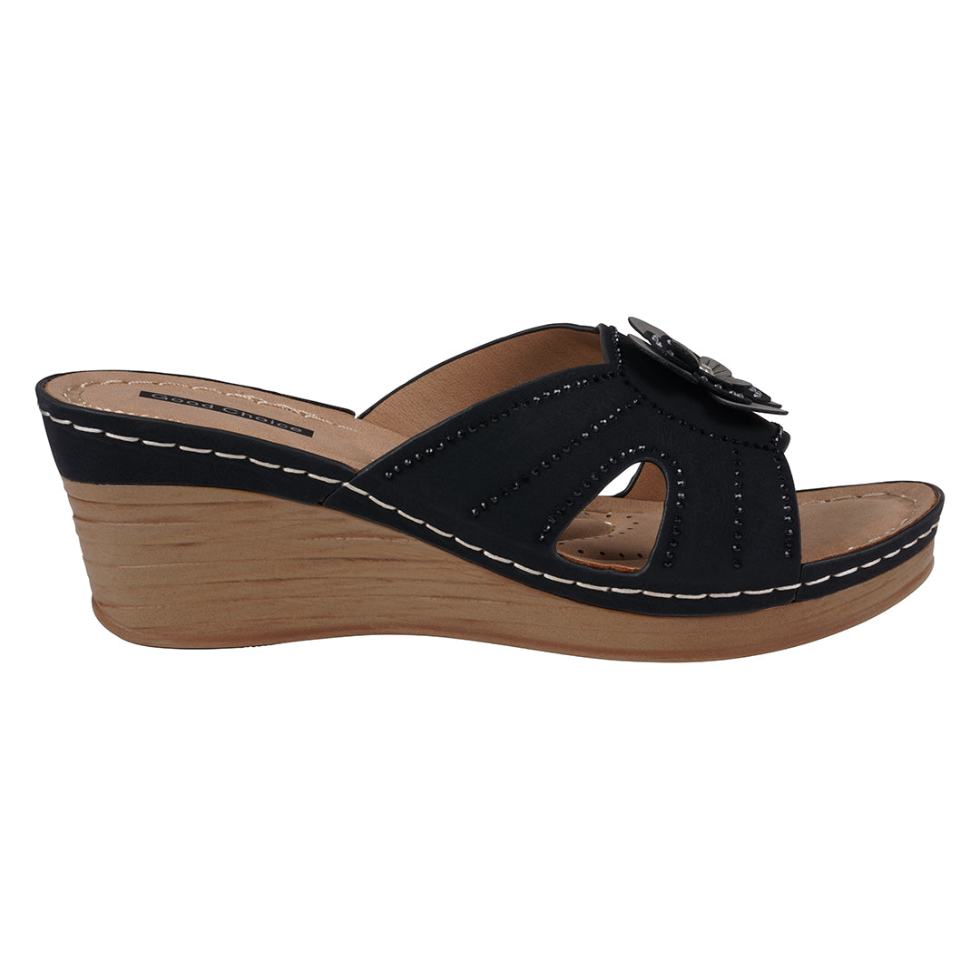Black wedge sandal with wooden sole on a white background
