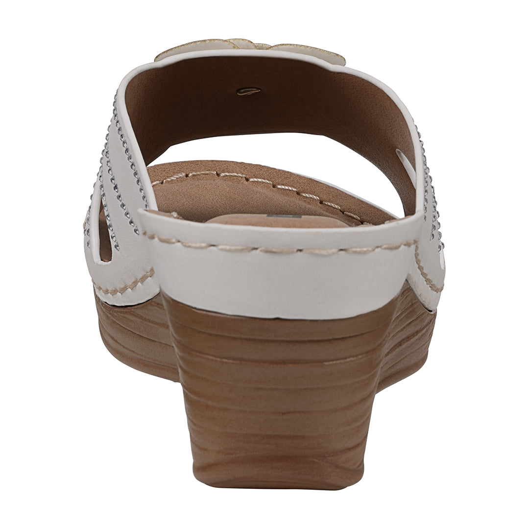Brown sandal with white strap on a white background