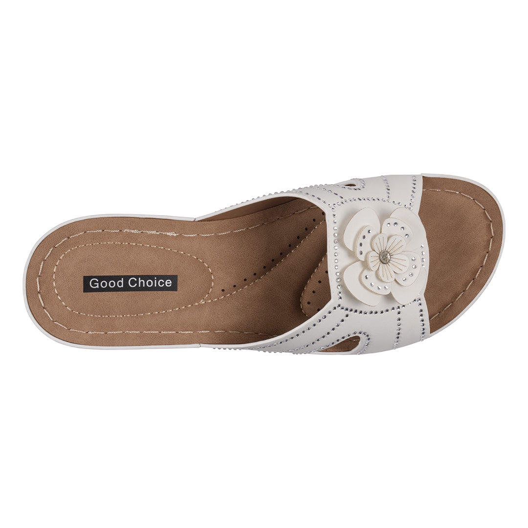 White sandal with a flower design on a brown insole, branded 'Good Choice'.