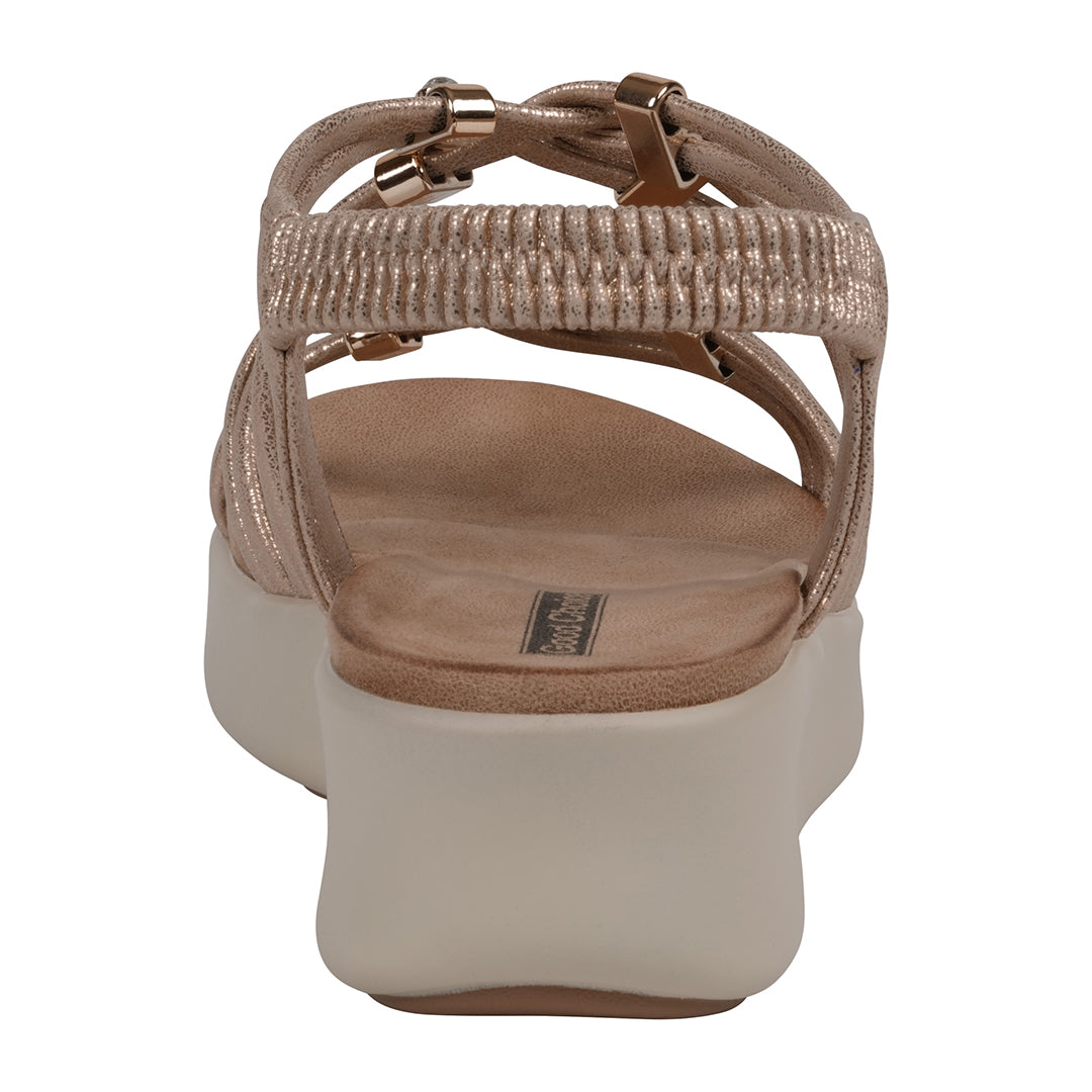 Beige sandal with a platform sole on a white background