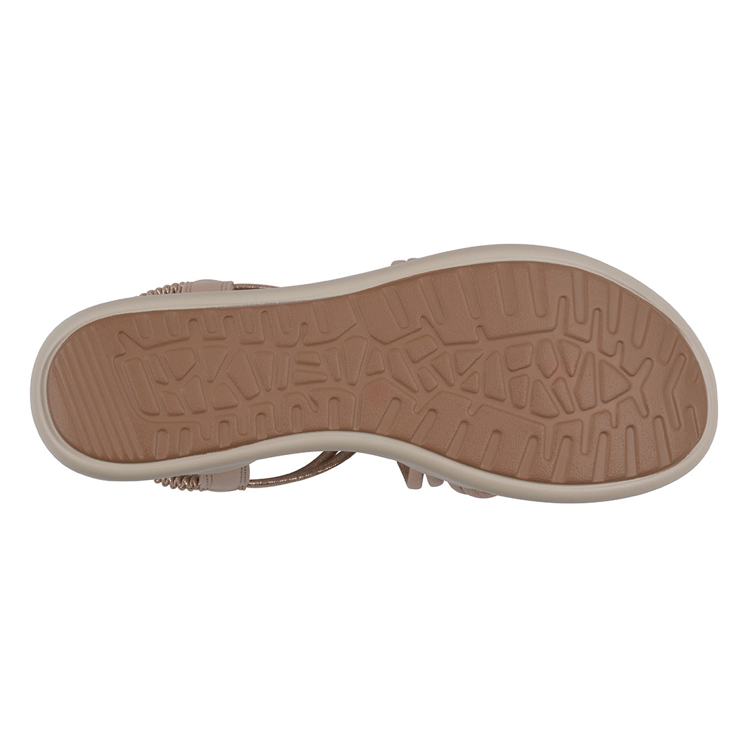 Close-up of a sandal sole with a textured pattern on a white background