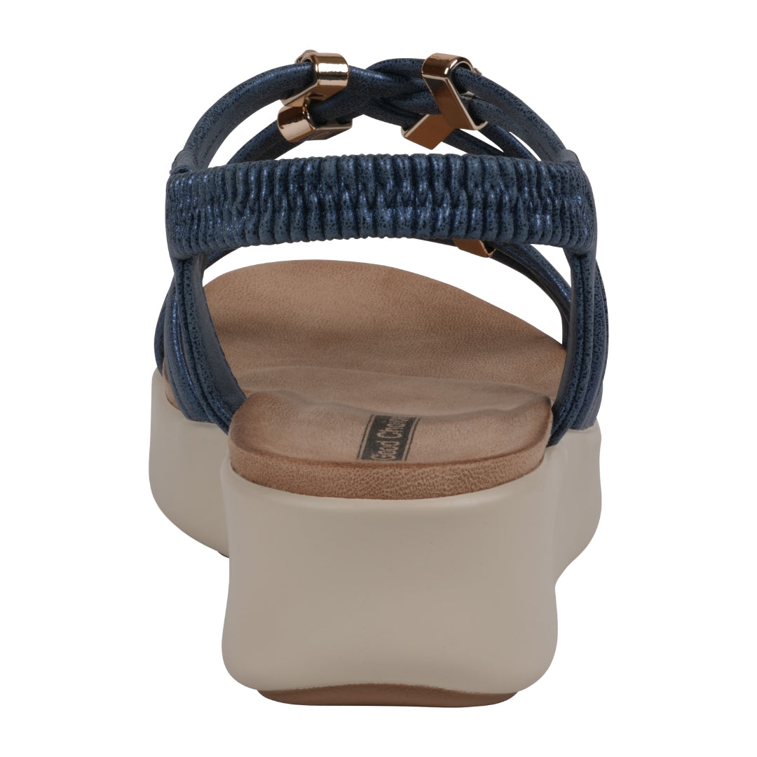 Navy sandal with a beige sole on a white background