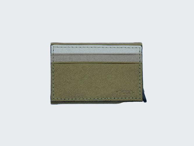 Green cardholder with a white interior on a light gray background