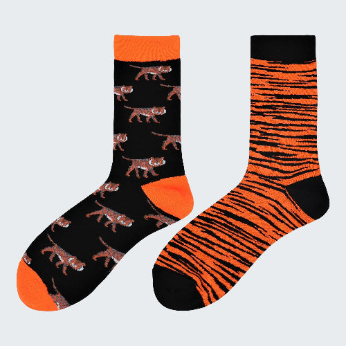 Two socks with tiger pattern design on a white background