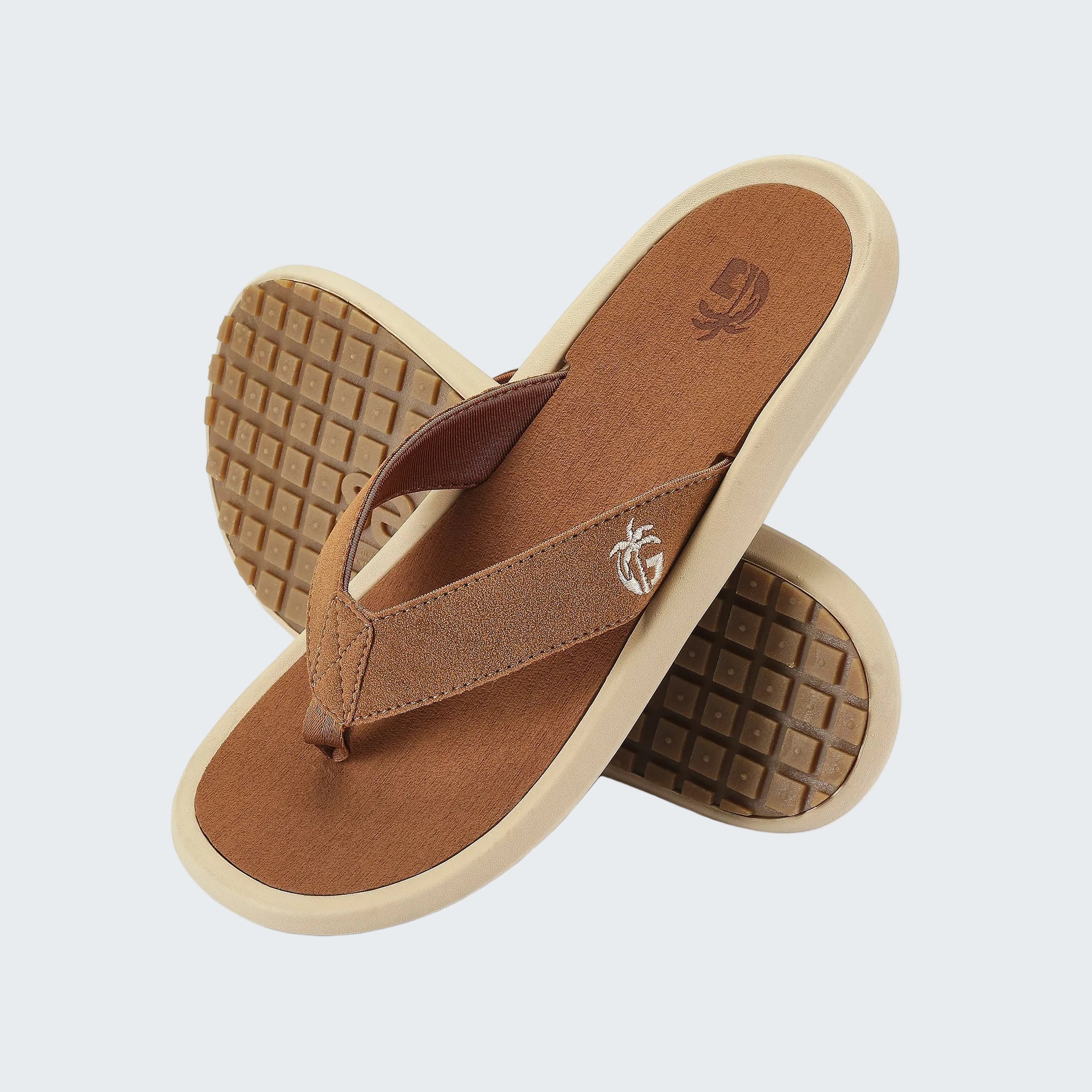 Brown sandals with beige soles on a white background