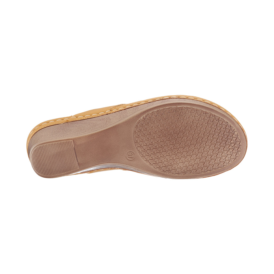 Tan shoe sole on a white background