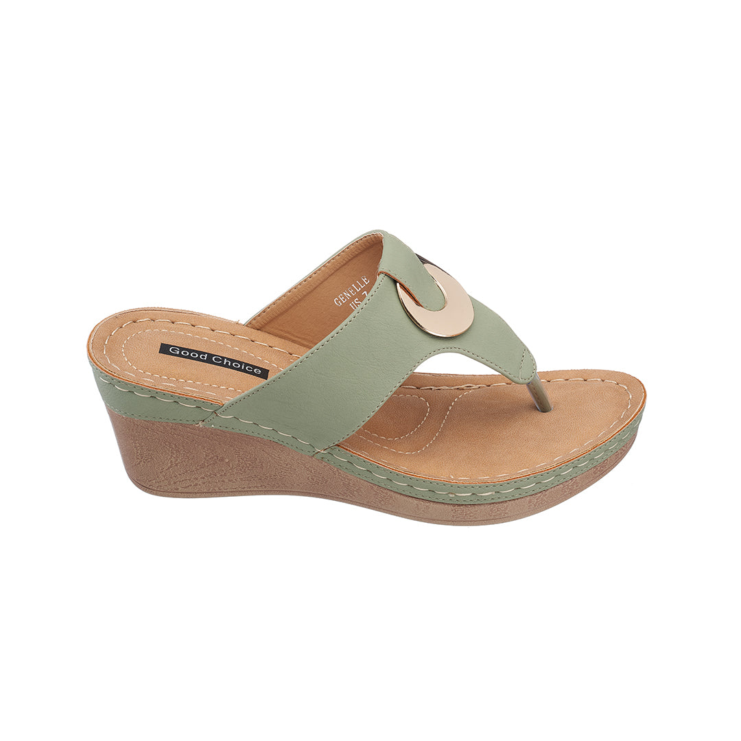 Green wedge sandal with tan sole on a white background