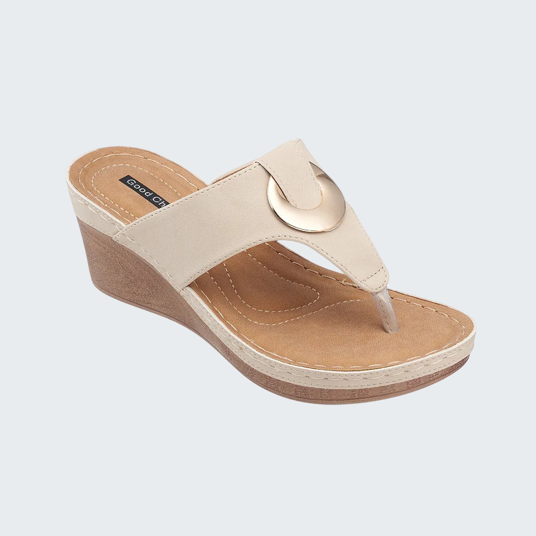 Beige wedge sandal on a white background