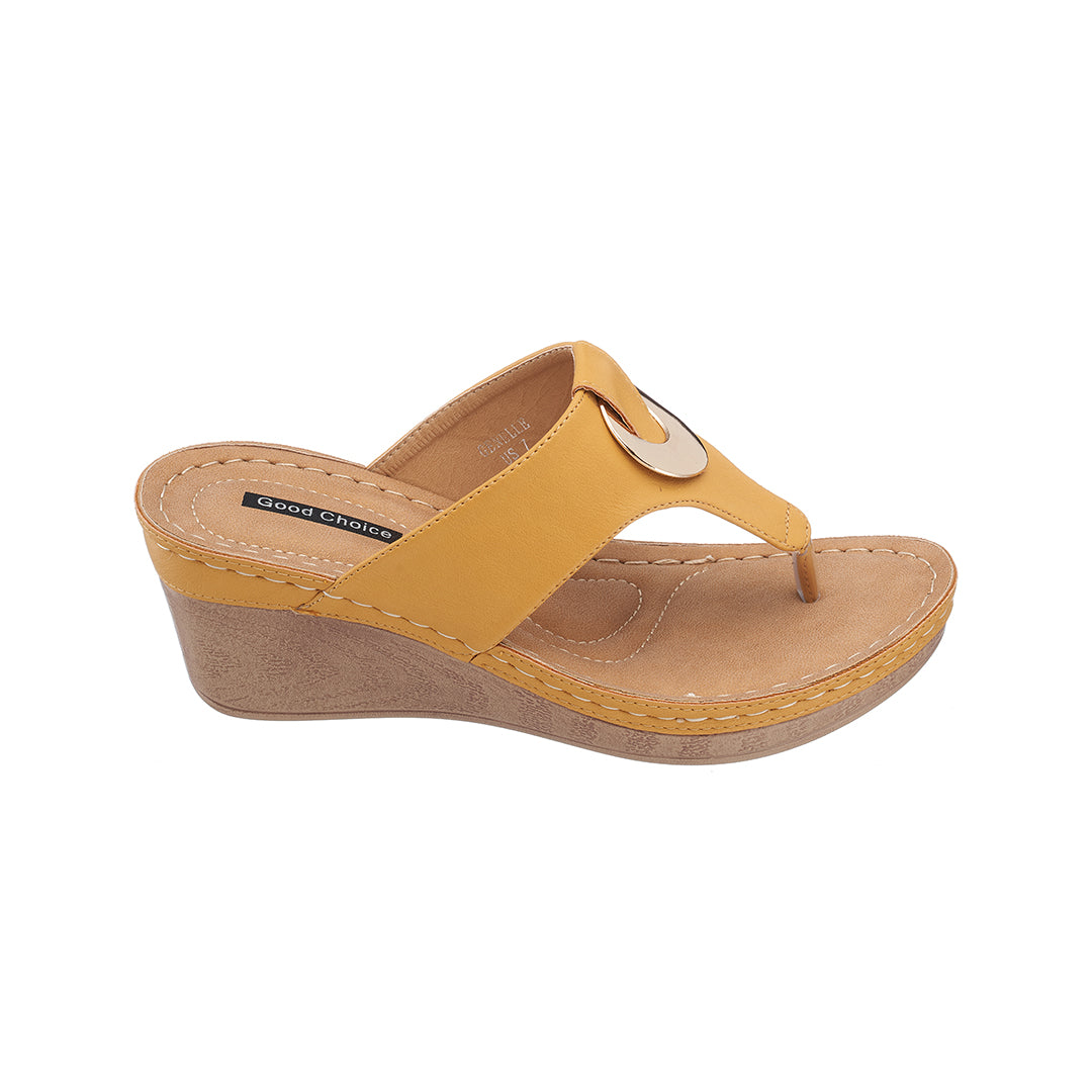Yellow wedge sandal on a white background