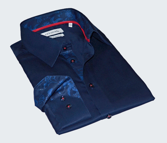 Folded navy blue shirt with red accents on a white background