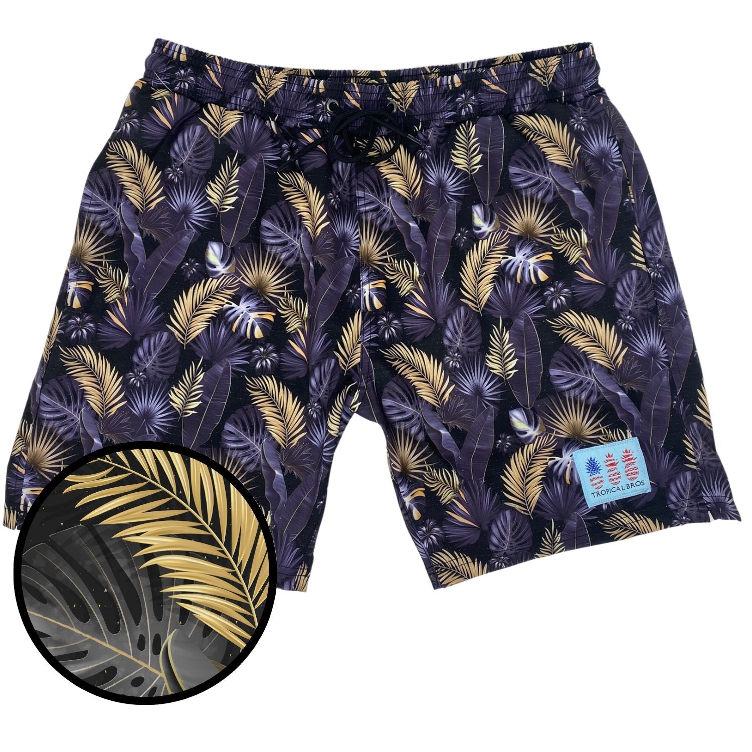 Tropical leaf patterned shorts with a close-up inset on a white background