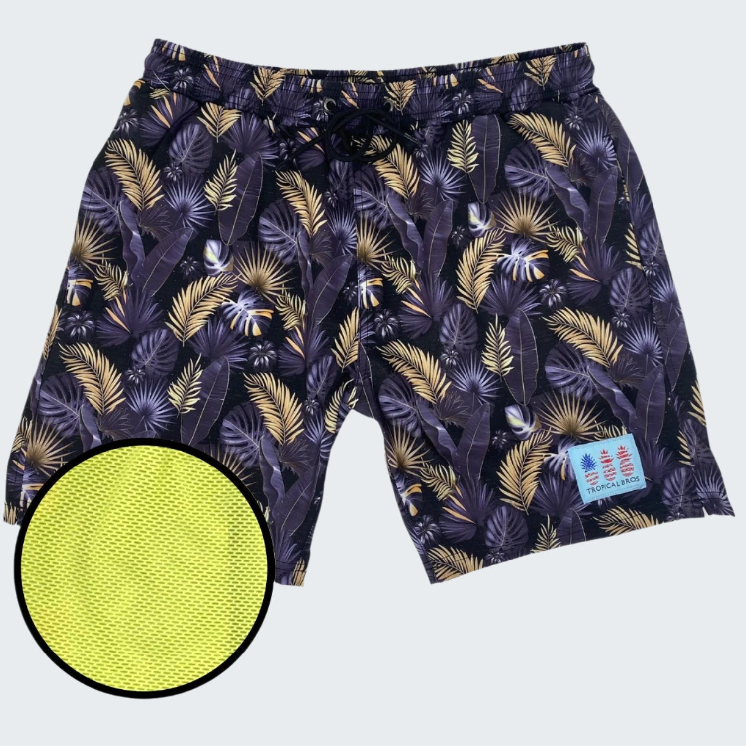 Tropical patterned shorts with a close-up of the textured material on a white background