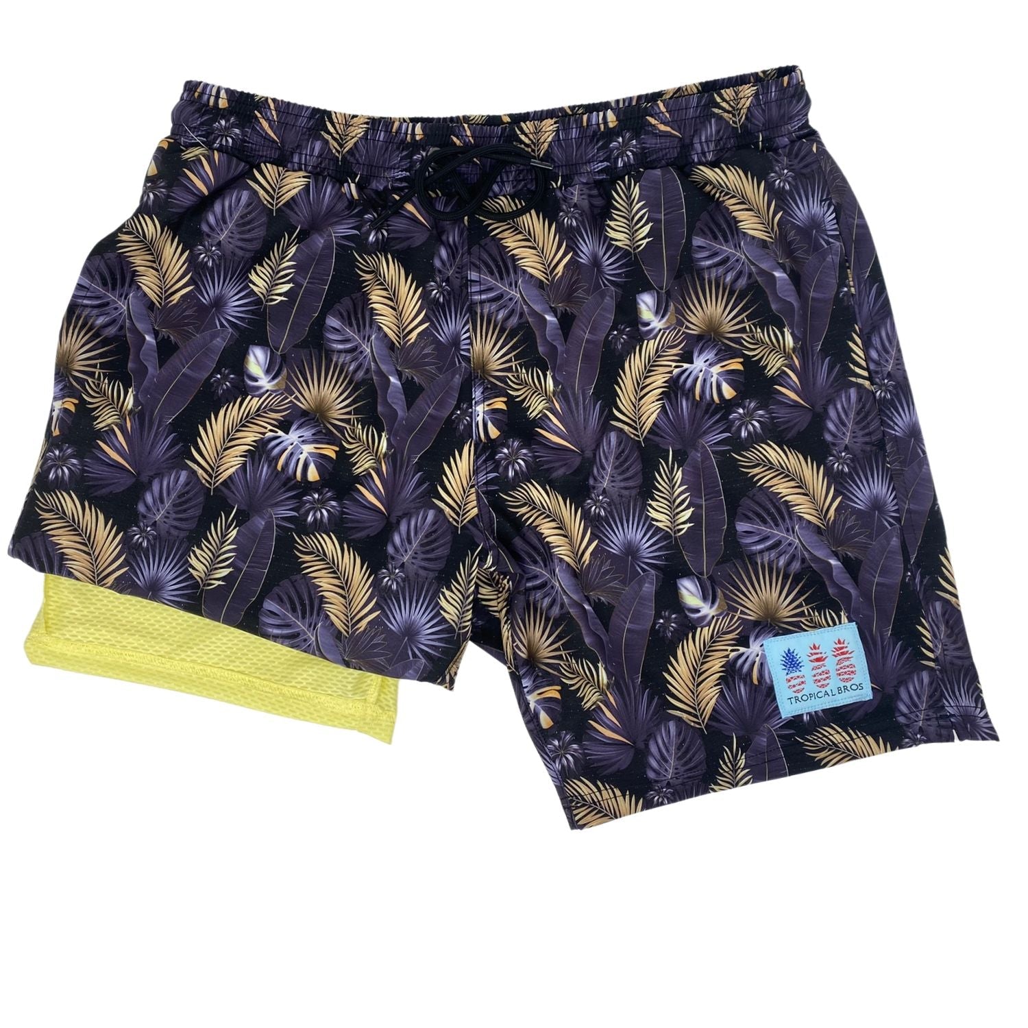 Tropical patterned shorts with a brand label on a white background