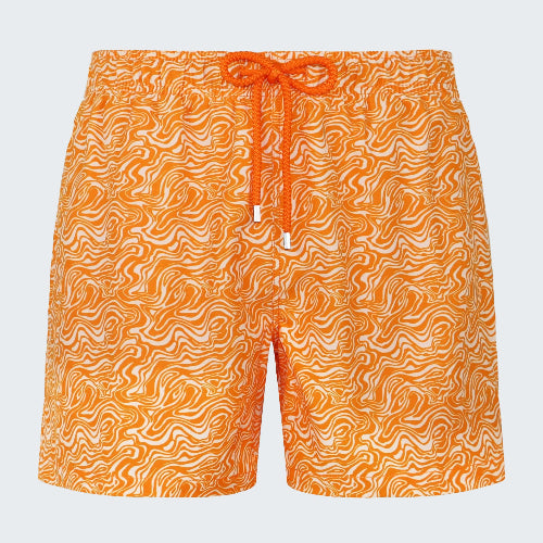 Orange swim shorts with a pattern on a white background