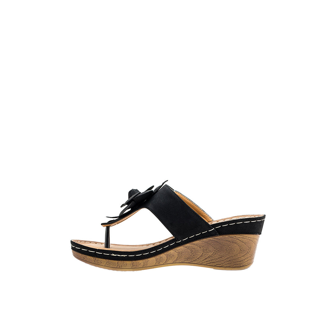 Black wedge sandal with wooden sole on a white background