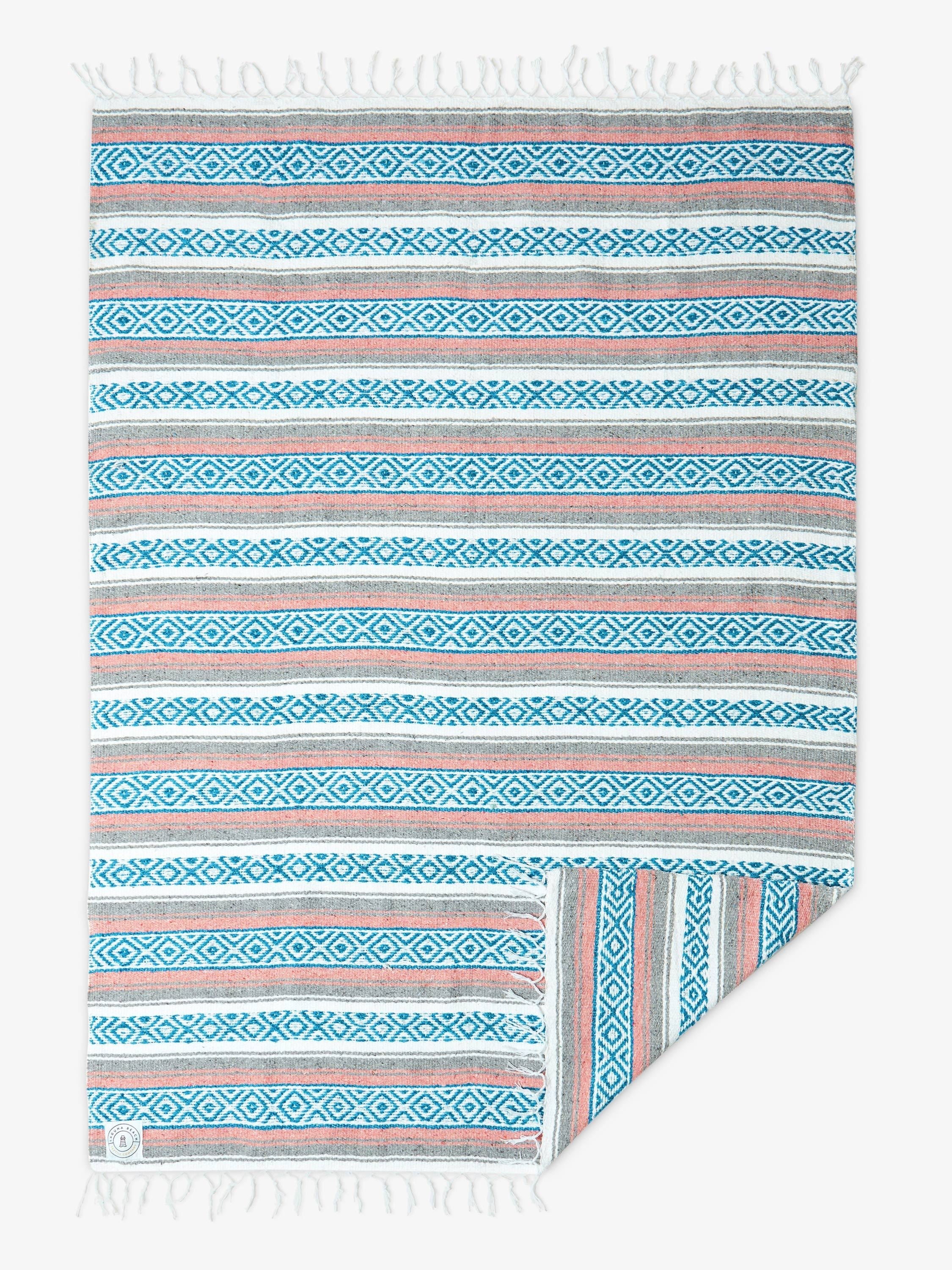 Striped towel with geometric pattern on a white background