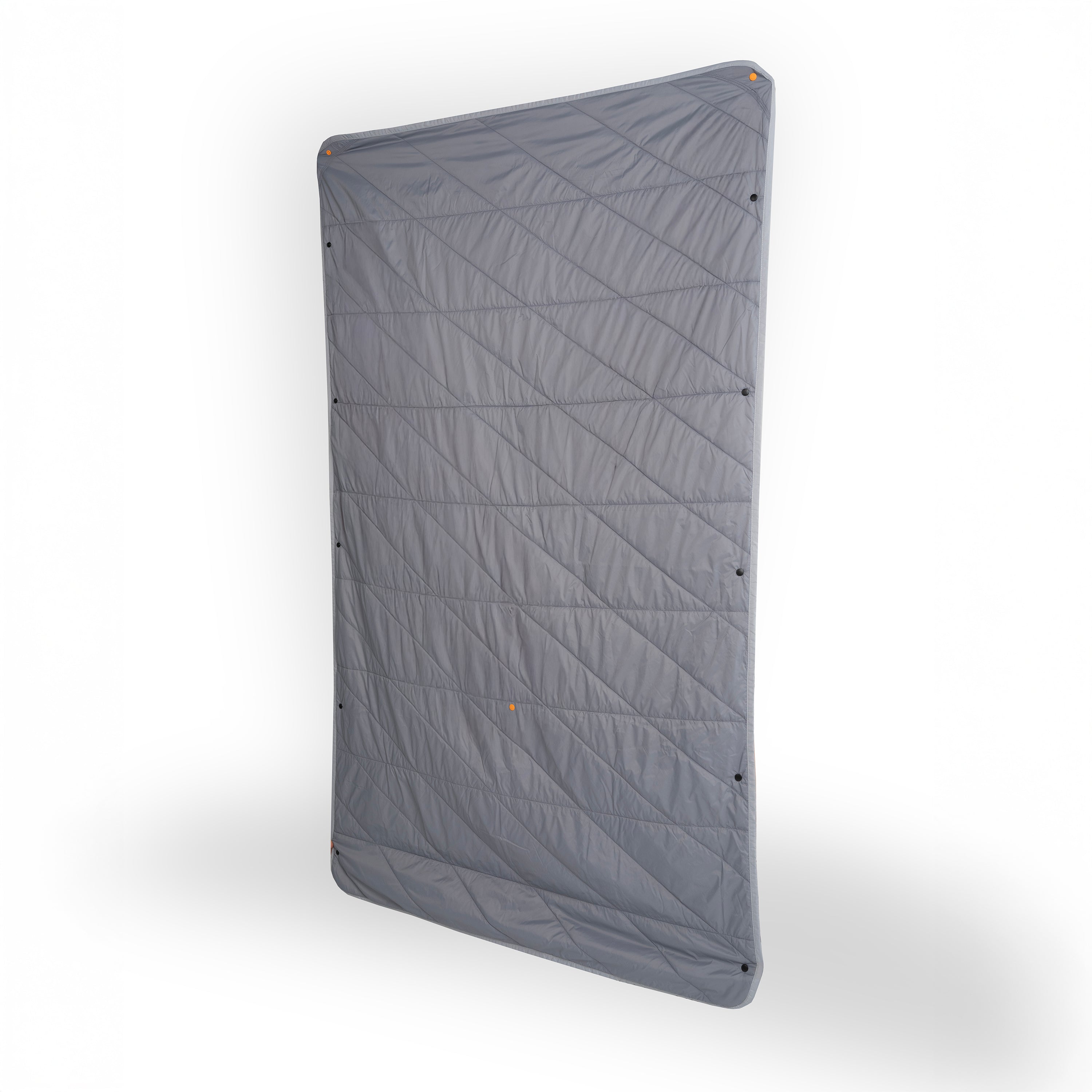 Gray quilted mat with geometric pattern on a white background