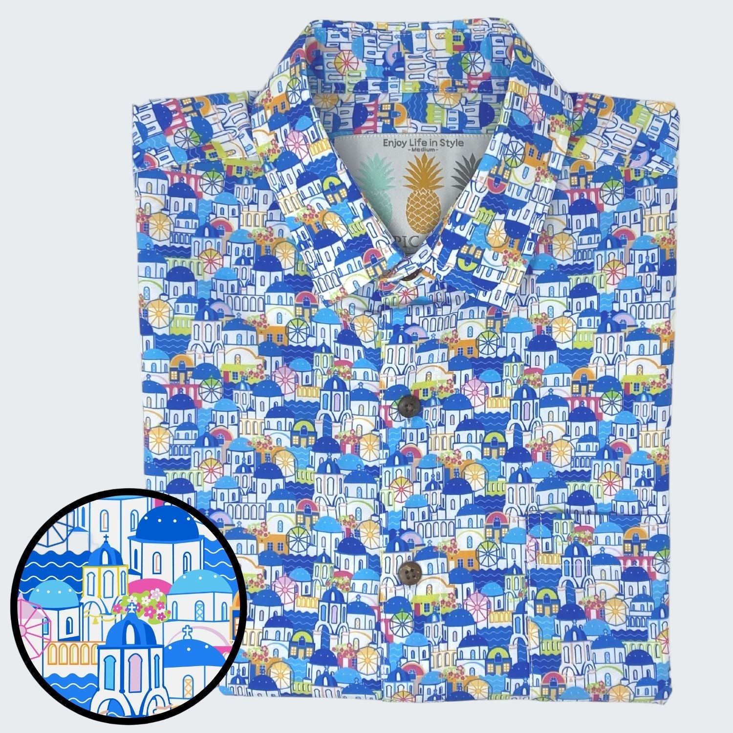 Colorful patterned shirt with a close-up of a design detail on a white background