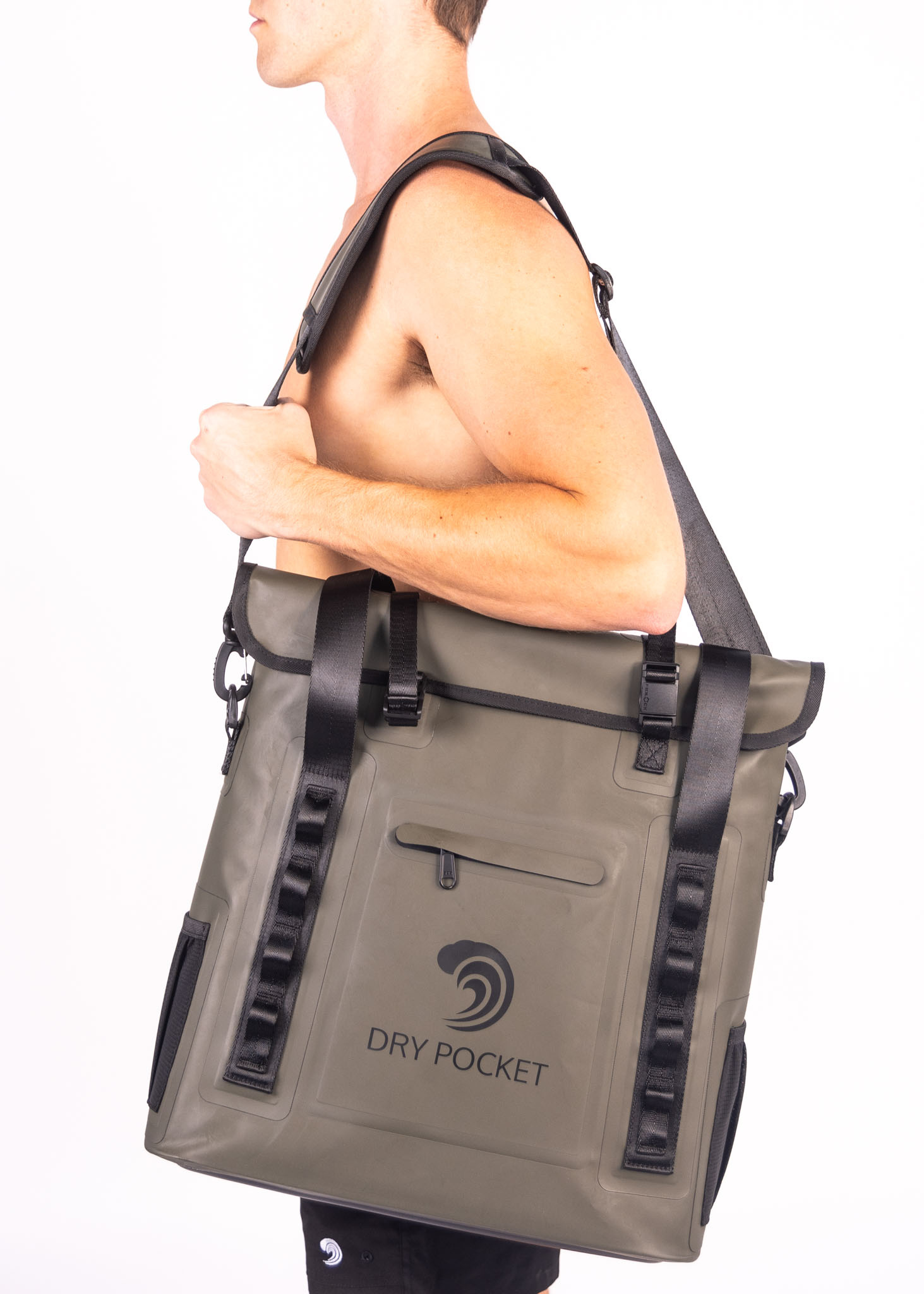 Person carrying a green dry bag with 'Dry Pocket' branding on a white background